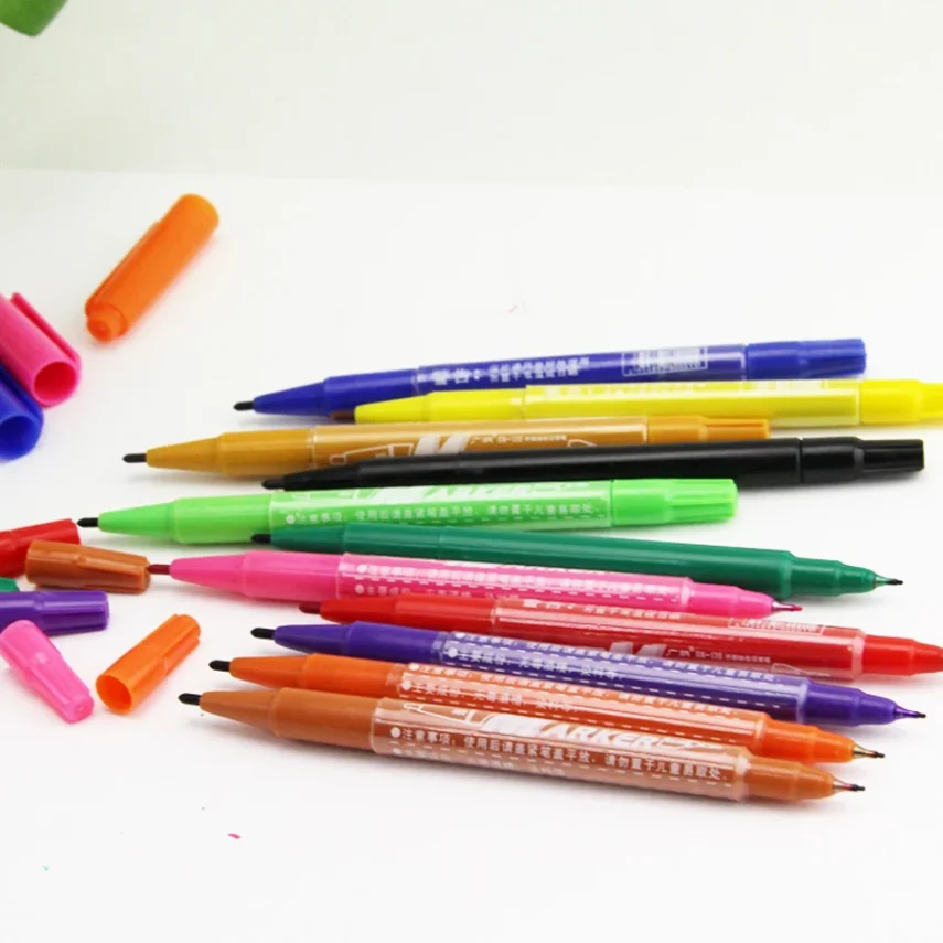 Assortment of design markers for sketching and coloring.