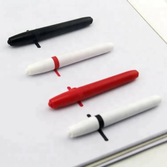 Sketch markers and other art supplies on a desk