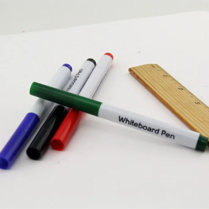 Assorted art supplies and stationery on a desk