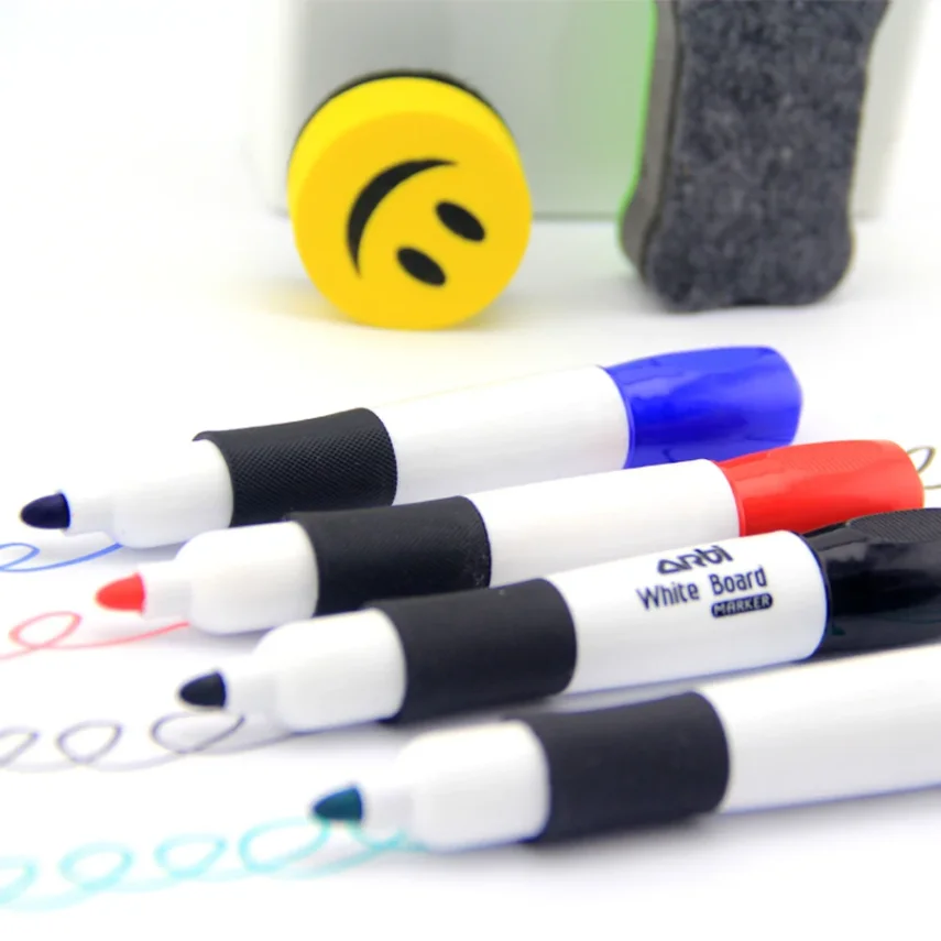 Sketch pad with drawing tools and accessories on a table