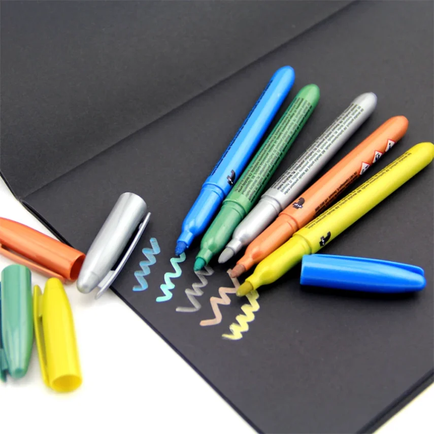 Art supplies including marker pens.