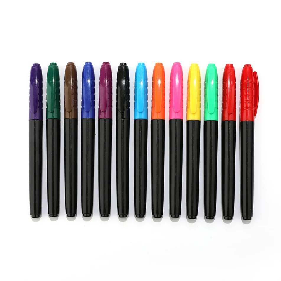 Sketch markers and other art supplies on a desk