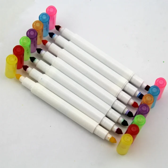 Collection of art supplies including marker pens and accessories