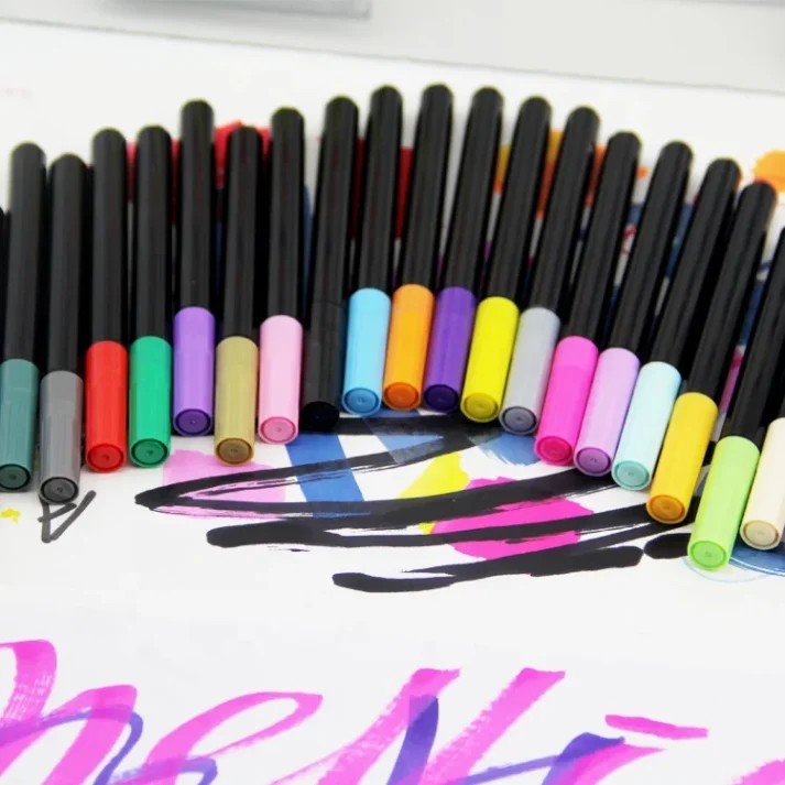 Art supplies including a set of marker pens.